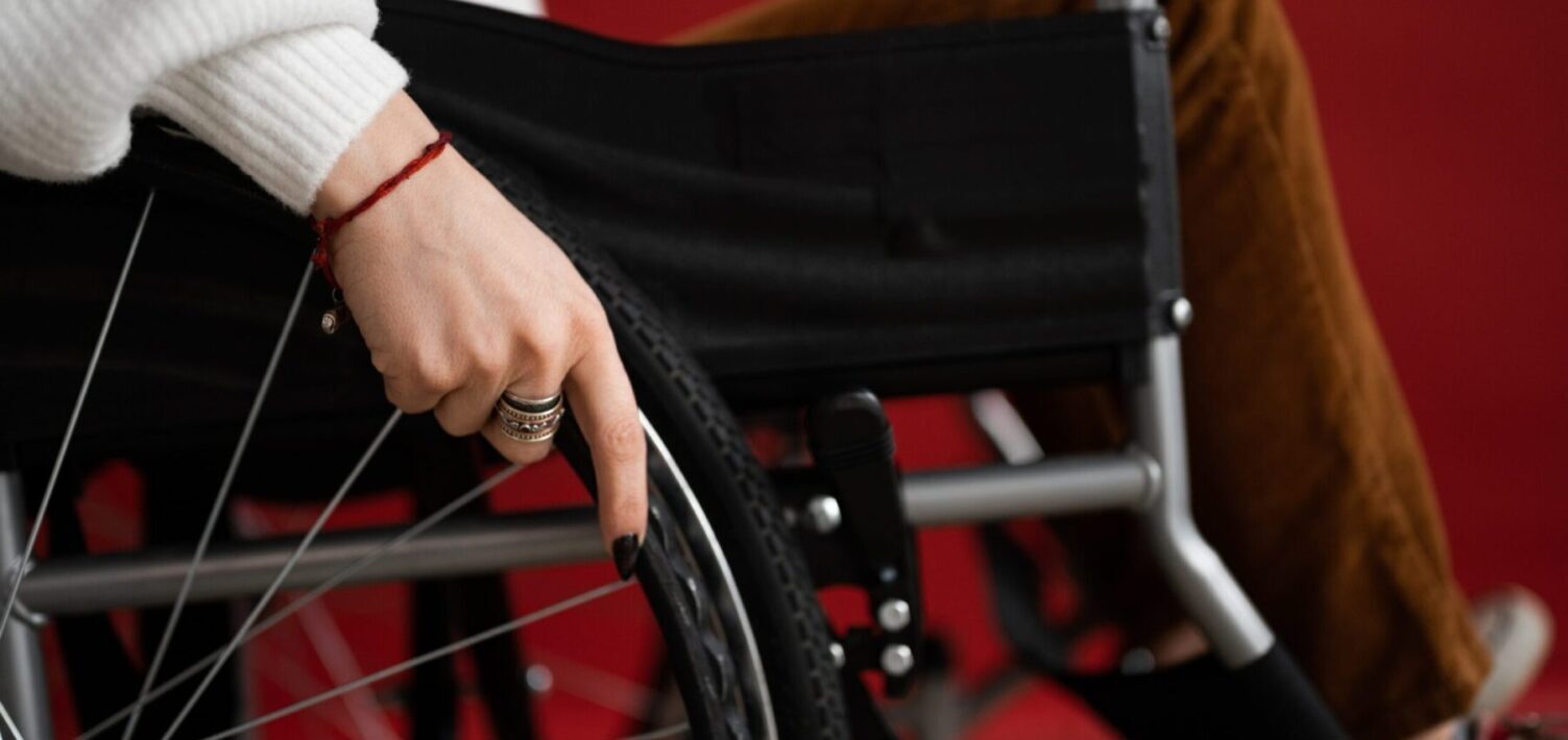 Woman's hand on wheelchair